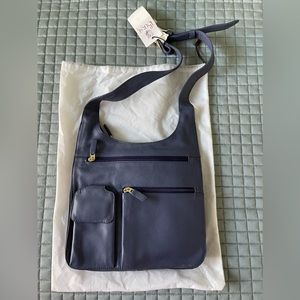 JPOurse travel bag crossbody. Blue leather. Brand new with tags.